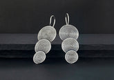 Tiered spiral disc drop earrings